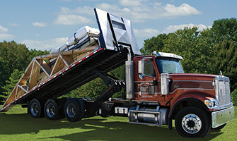 semi-truck towing wooden gables