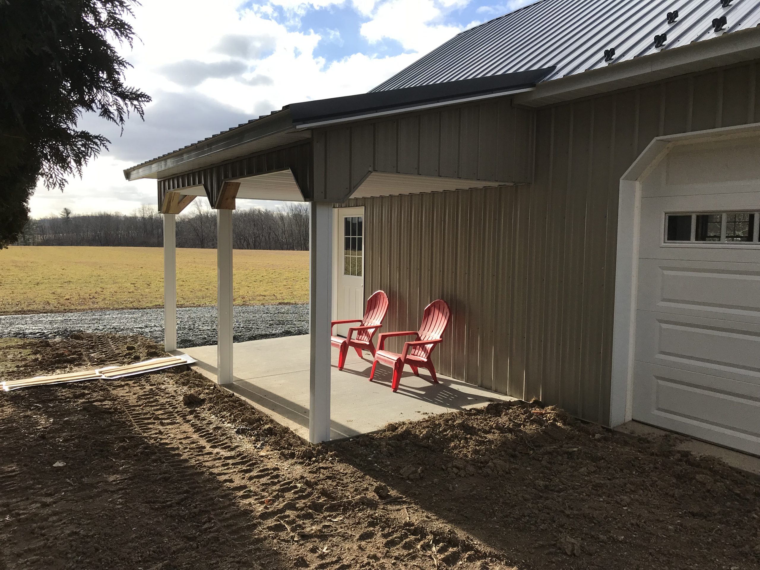 metal overhang eave attached to new post-frame garage