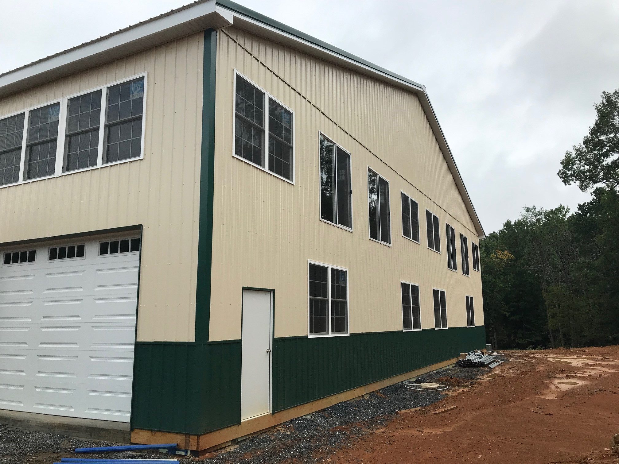 tan and green metal siding on new pole barn garage