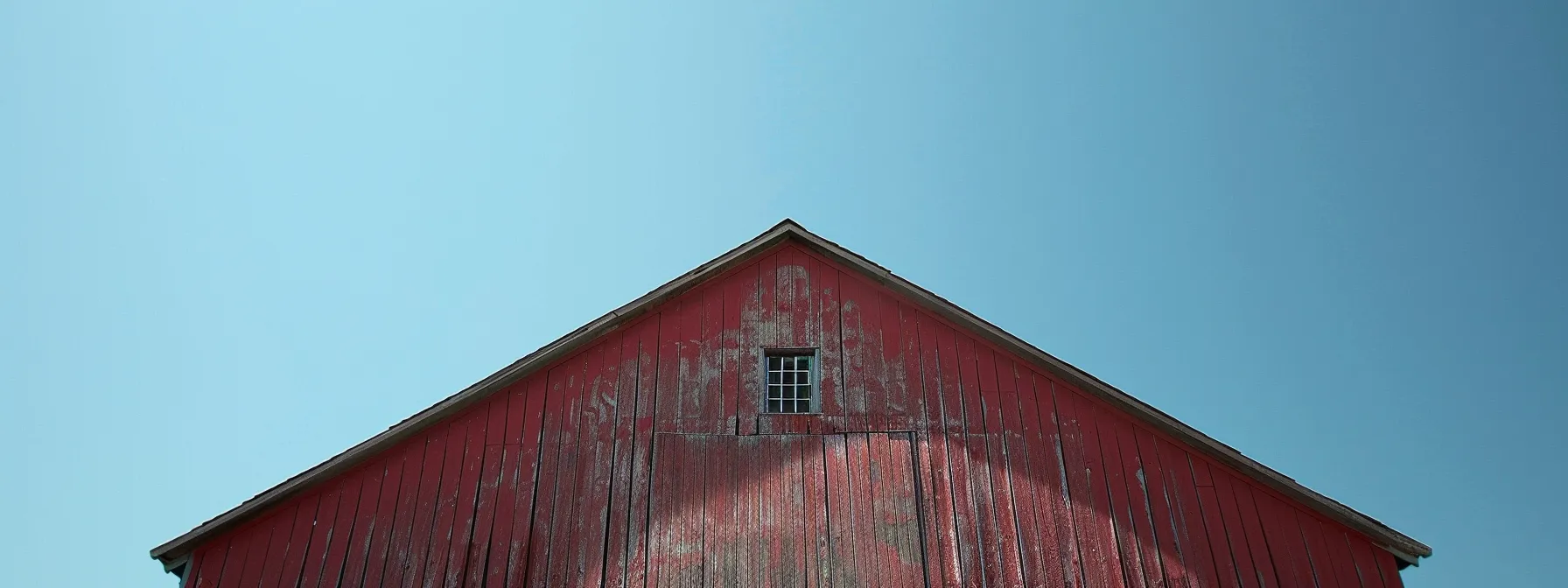 a sturdy pole building in charleston, wv stands tall against the backdrop of a clear sky, symbolizing reliability and durability for local farmers.